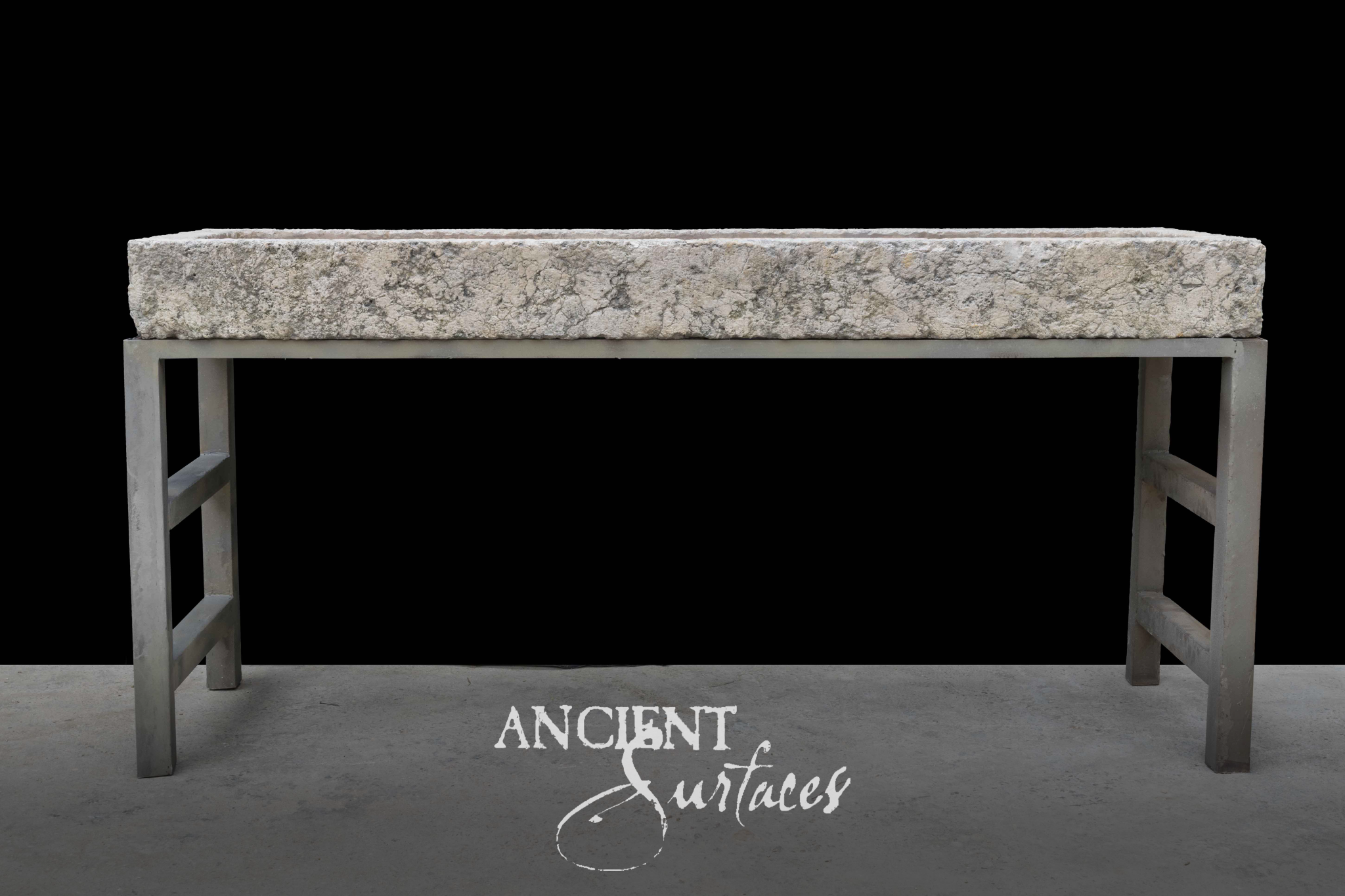 Rough speckled grey granite trough basin on a grey iron stand with square legs
