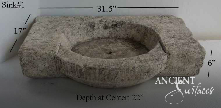 Rustic rectangular stone trough with a circular dished well and rough tooled sides